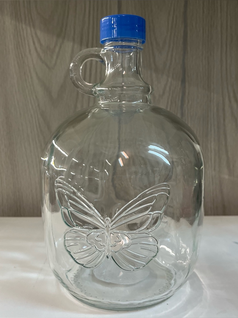 Dolly Parton 64 oz Glass Growler Moonshine Jug Butterfly Design Blue 9 1/2×5 1/2